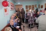 увеличить